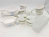 Group shot showing all CorningWare, Corelle plates and cups, and glass trays