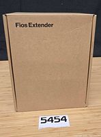 Closed brown box labeled Fios Extender
