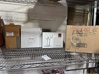 Shelf with six boxes and loose stem glass