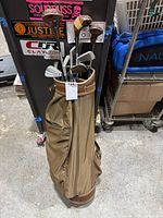 Full view of golf bag with clubs