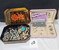 Both jewelry boxes open showing contents