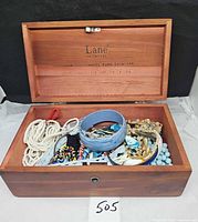 Open Lane cedar box showing all costume jewelry pieces inside