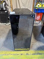 Front view of black Oster wine fridge with glass door and control panel