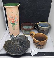 Group shot showing all five pottery items
