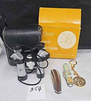 Full lot: binoculars with case and box, two pocket knives, keychain
