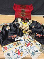 jacket laid out with wind chimes and jewelry box
