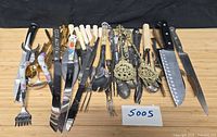 entire assortment of flatware and cutlery laid out