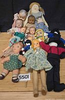 Overview of entire lot showing variety of cloth, composition and plastic dolls