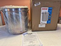 Stockpot beside original box and instruction sheet