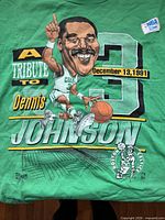 Front graphic of green Dennis Johnson tribute T-shirt