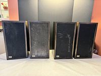 Front view of all four speakers with grilles attached