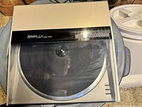 Turntable closed showing top view with dust cover and model marking