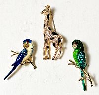 Overview showing all three animal brooches