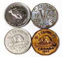 Four coins laid out showing obverse designs and dates