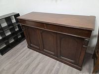 Full view of sideboard showing three doors and overall design