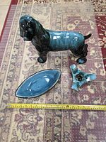 All three glazed ceramic pieces with measuring tape for scale