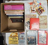 Overall contents of cookbook lot displayed around box