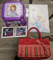 Group shot of stepstool, memo board, two prints, red tote