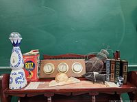 Full lot view showing all decorative items on wooden shelf