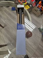 Moen grab bar in original box showing brand and color