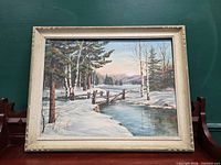 Front view of framed winter landscape oil painting