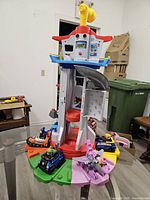 Front view of tower showing vehicles on coloured platforms