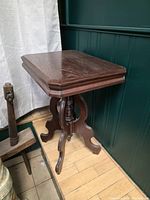 Overall view of square-top wooden plant stand