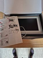 Frame, manual and cable inside box