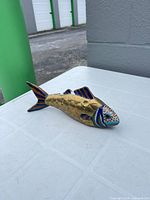 Left side view of brass cloisonné fish