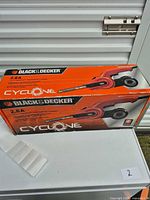 Front view of boxed Black & Decker Cyclone CYPF260 precision belt sander
