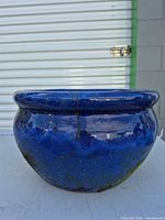 Front view of blue glazed ceramic planter