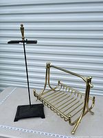Overall view of brass log rack and fireplace tool stand