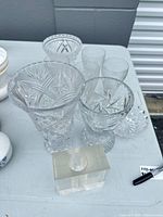 Group view of tall vase, two flutes, compote, small dish