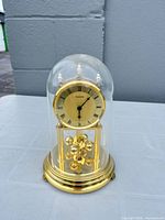 Full view of Eurena anniversary clock under glass dome