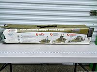 Full view of unopened EZ-TENT carry bag showing product branding and setup illustrations