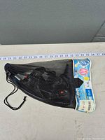 Mask set inside mesh bag with size label visible