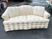 Front view showing entire sofa with cushions and striped upholstery