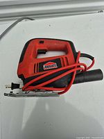 Full view of JobMate jigsaw showing body, cord, and label