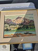 Mountain landscape painting in gold frame with linen mat under glass