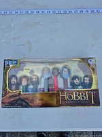 Front of sealed PEZ Hobbit 8-dispenser set showing characters and branding