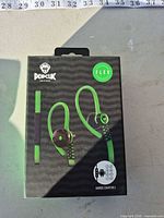 Front of sealed Popclik Flex earphone box