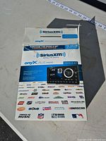 Front of retail box showing SiriusXM Onyx Plus Vehicle Kit packaging