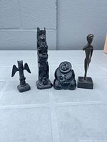All four soapstone figurines grouped