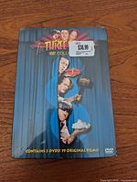 Front of DVD box set showing title, artwork, pricing sticker, shrinkwrap