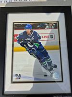Framed photo showing full image of Henrik Sedin skating