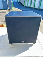 Front view of black Vector Research subwoofer cube