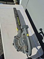 Full view of Yardworks blower/vacuum laid on table showing overall length