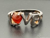 Front view showing LOVE lettering and heart carnelian