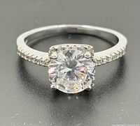 Front view of ring showing central stone and pavé accents