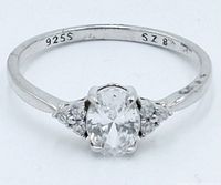 Close-up of entire ring top view showing center and side stones